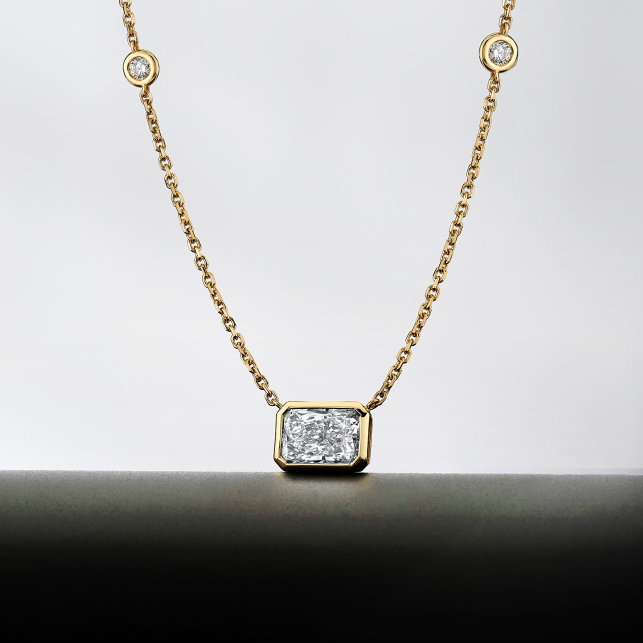Diamond Station Pendant with Radiant Cut Center Stone