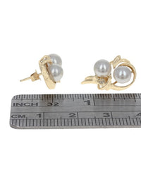 White Pearl and Diamond Swirl Stud Earrings in Yellow Gold