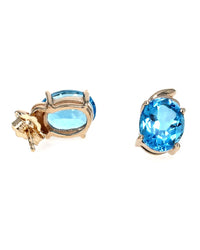 Swiss Blue Topaz Swirl Accent Stud Earrings in Yellow Gold