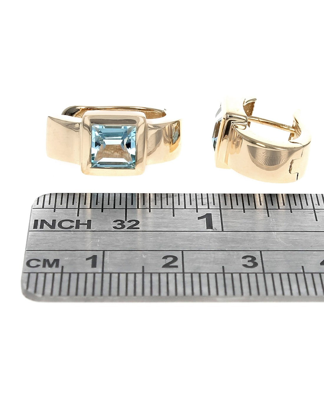 Sky Blue Topaz Curved Hoop Earrings in Yellow Gold