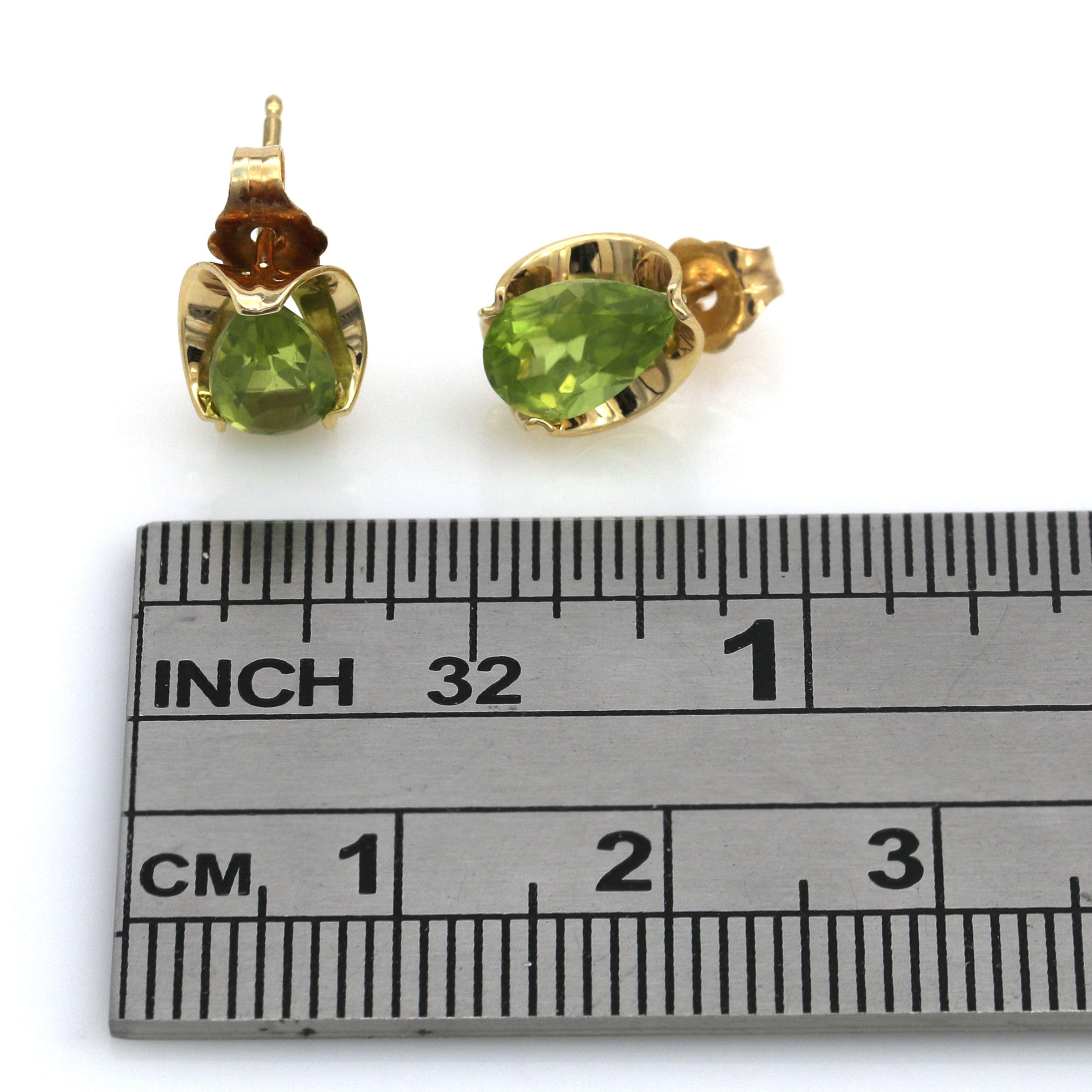 Pear Cut Peridot Stud Earrings in Yellow Gold