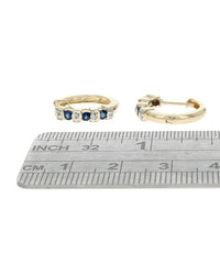 Alternating Diamond and Blue Sapphire Huggie Earrings in Yellow Gold