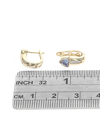 Tanzanite and Diamond Huggie Earrings in Yellow Gold