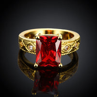 Ruby Emerald Cut Center Halo Ring in 18K Gold