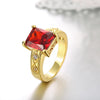 Ruby Emerald Cut Center Halo Ring in 18K Gold