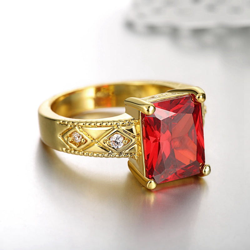 Ruby Emerald Cut Center Halo Ring in 18K Gold