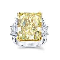 18.88 Carat Radiant Fancy Intense Yellow Diamond 3-stone Ring