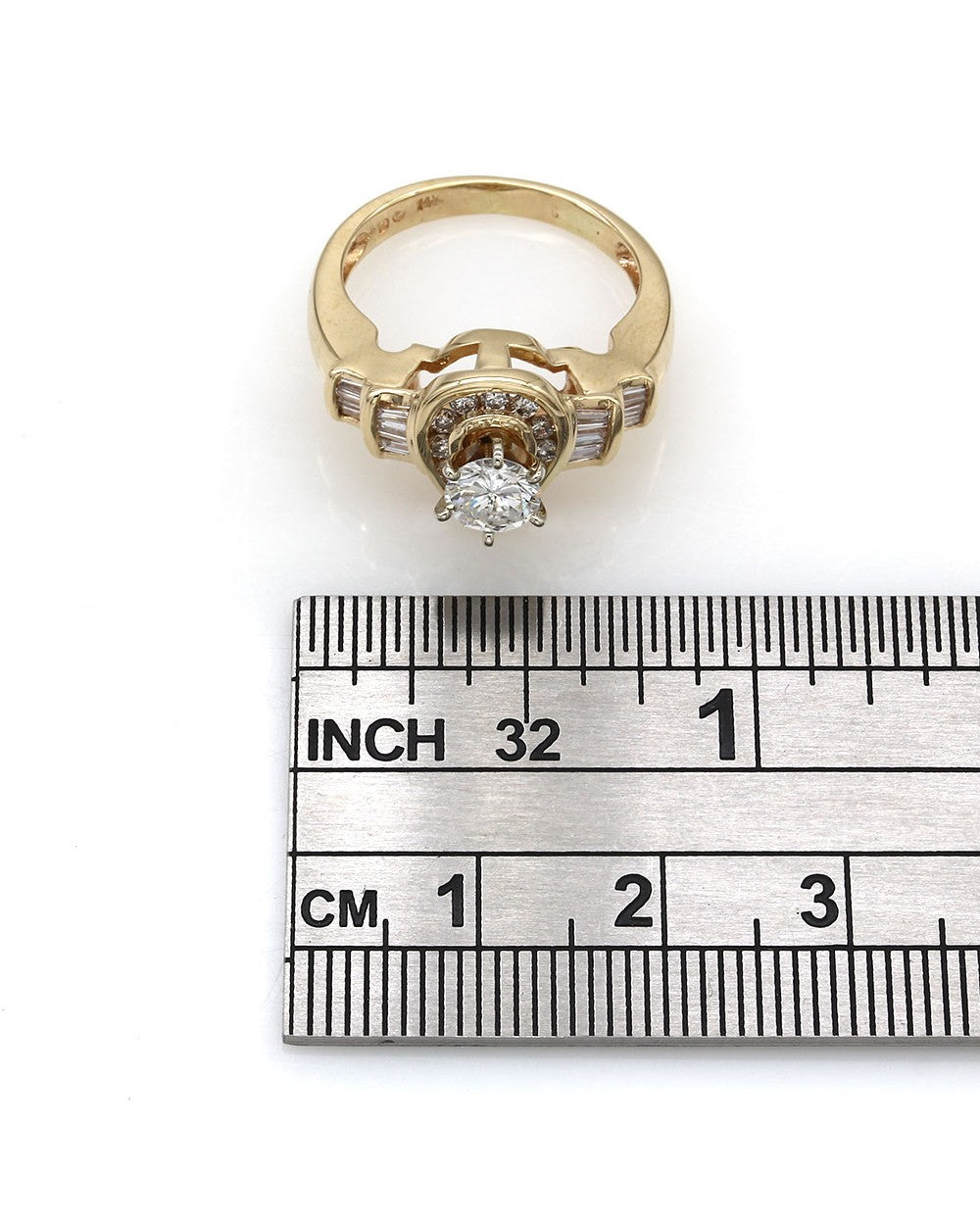 Round and Baguette Diamond Pear Shaped Ring in Gold