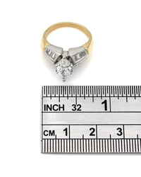 Channel Set Baguette Diamond Ring with 1.17ct Marquise Center Diamond in 18ktt