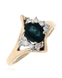 Oval Dark Blue Sapphire and Diamond Accent Ring in Yellow Gold