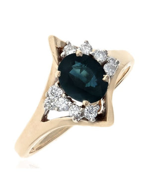 Oval Dark Blue Sapphire and Diamond Accent Ring in Yellow Gold