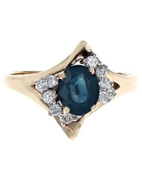 Oval Dark Blue Sapphire and Diamond Accent Ring in Yellow Gold