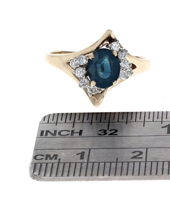 Oval Dark Blue Sapphire and Diamond Accent Ring in Yellow Gold