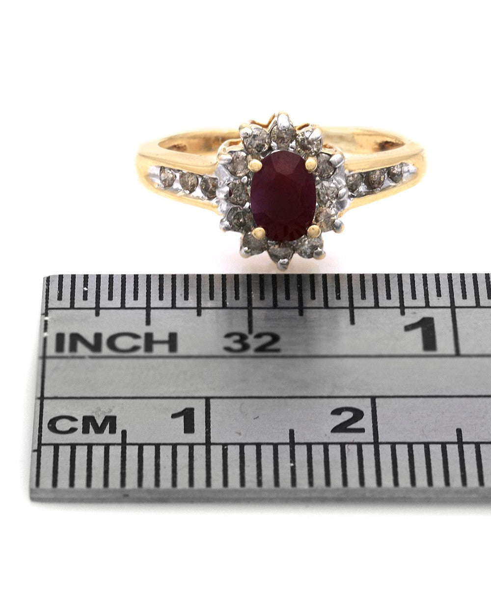 Ruby and Diamond Halo Ring in White and Yellow Gold
