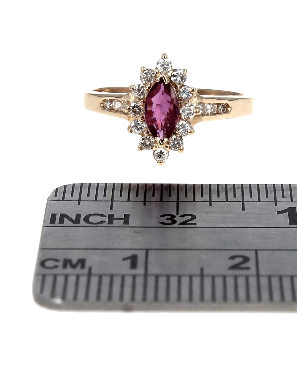 Ruby and Diamond Halo Ring in Yellow Gold