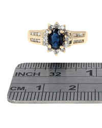 Dark Blue Sapphire and Diamond Halo Ring in Yellow Gold