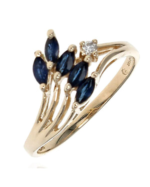 Blue Sapphire and Diamond Accent Wave Ring in Yellow Gold