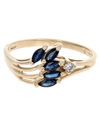Blue Sapphire and Diamond Accent Wave Ring in Yellow Gold