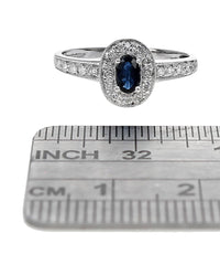 Blue Sapphire and Diamond Halo Ring in White Gold