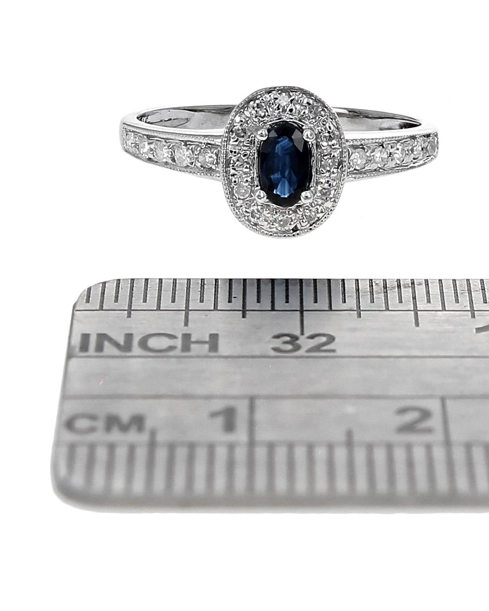 Blue Sapphire and Diamond Halo Ring in White Gold
