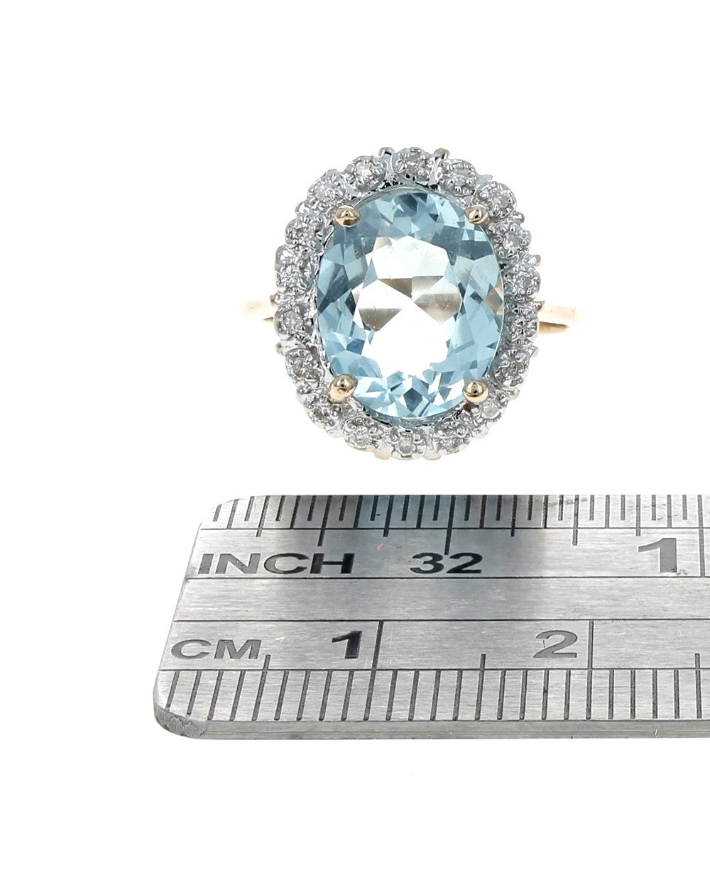 Aquamarine and Diamond Halo Ring in 2 Toned Gold