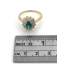 Oval Emerald and Diamond Double Halo Ring