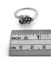 Blue Sapphire and Diamond Bypass Ring in White Gold