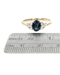 Dark Blue Sapphire and Diamond Accent Ring in Yellow Gold