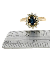 Dark Blue Australian Sapphire and Diamond Halo Ring in Yellow Gold