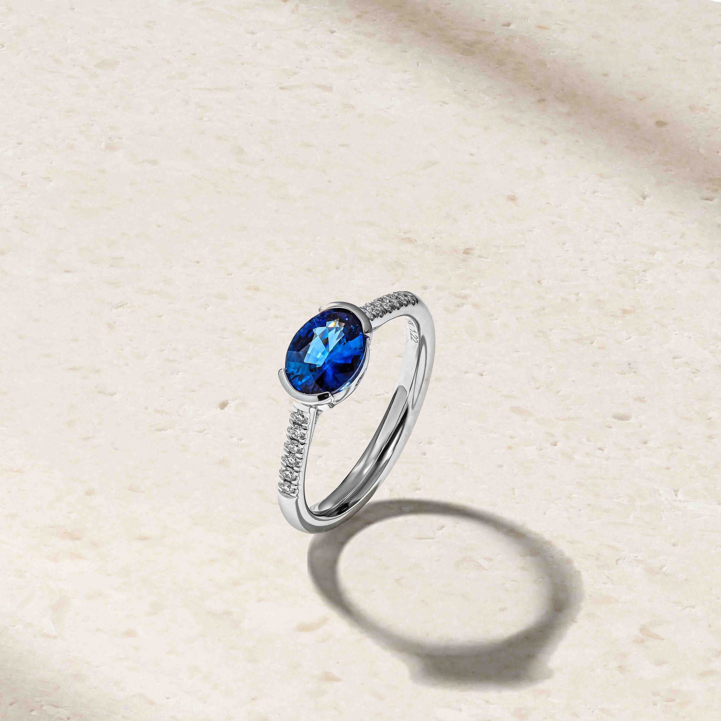 East-West Sapphire and Diamond Half Bezel Ring