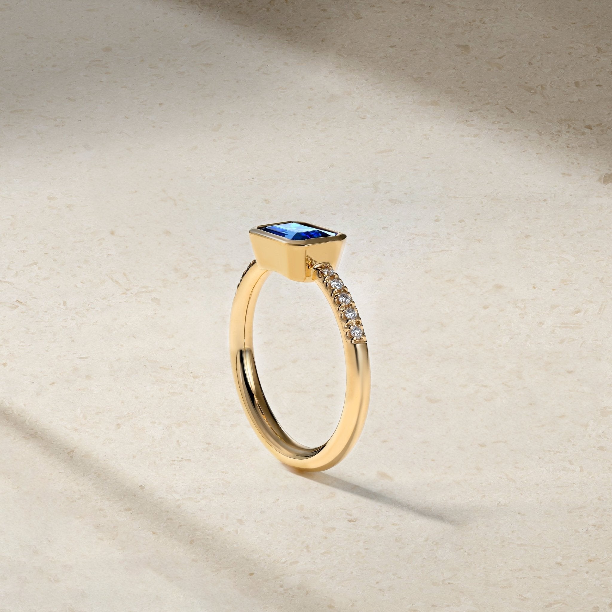 East-West Emerald Cut Sapphire and Diamond Bezel Ring