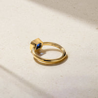 East-West Emerald Cut Sapphire and Diamond Bezel Ring