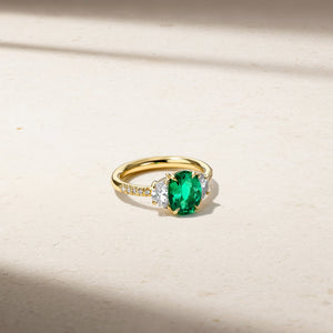 Nouveau Three Stone Oval Emerald and Diamond Ring