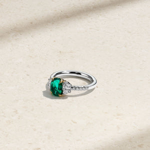 Nouveau Two Tone Three Stone Oval Colombian Emerald and Diamond Ring