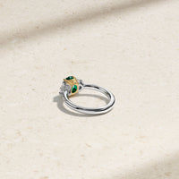 Nouveau Two Tone Three Stone Oval Colombian Emerald and Diamond Ring