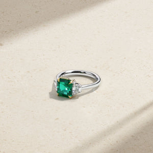 Nouveau Two Tone Three Stone Octagonal Emerald and Diamond Ring