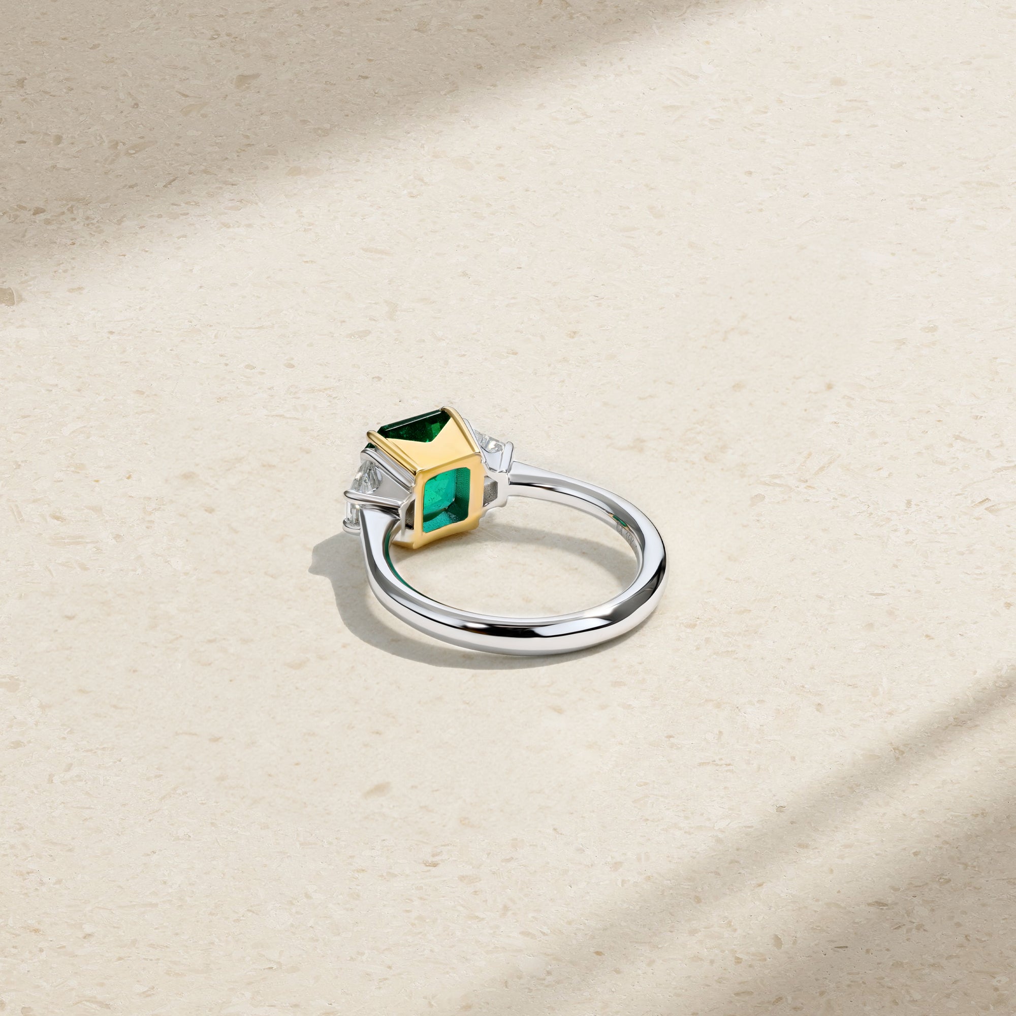 Nouveau Two Tone Three Stone Octagonal Emerald and Diamond Ring