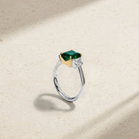 Nouveau Two Tone Three Stone Octagonal Emerald and Diamond Ring