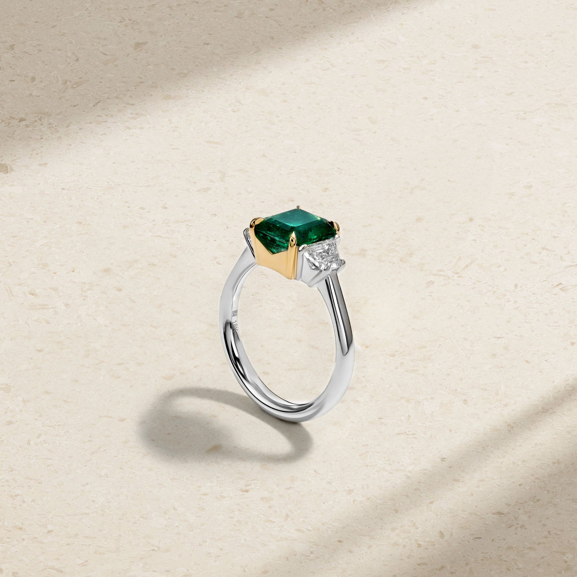 Nouveau Two Tone Three Stone Octagonal Emerald and Diamond Ring