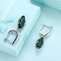 Emerald Oval Cut Earrings Set in 18K White Gold - Golden NYC Jewelry