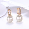 Micro-Pav'e Austrian Crystal Curved Pearl Huggie Earrings Set in 18K Gold - Golden NYC Jewelry