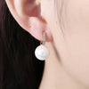 Micro-Pav'e Austrian Crystal Curved Pearl Huggie Earrings Set in 18K Gold - Golden NYC Jewelry
