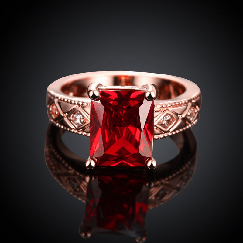 Ruby Emerald Cut Center Halo Ring in 18K Rose Gold