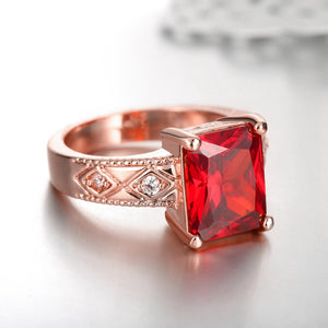 Ruby Emerald Cut Center Halo Ring in 18K Rose Gold