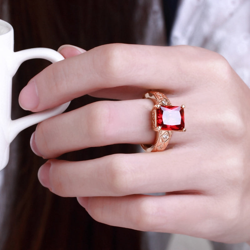 Ruby Emerald Cut Center Halo Ring in 18K Rose Gold