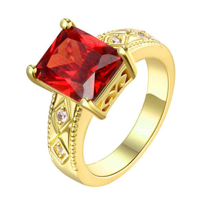 Ruby Emerald Cut Center Halo Ring in 14K Gold