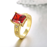 Ruby Emerald Cut Center Halo Ring in 14K Gold