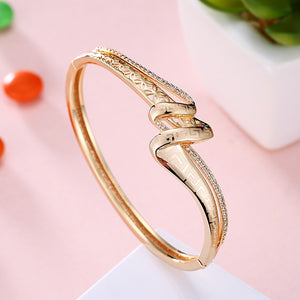 Austrian Crystal 18K Gold Plated Iception Twist Bangle - Golden NYC Jewelry