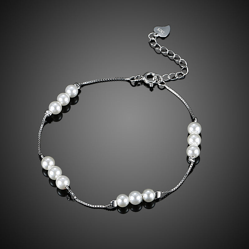 Sterling Silver Simulated Twelve Pearls Modern Bracelet - Golden NYC Jewelry www.goldennycjewelry.com fashion jewelry for women